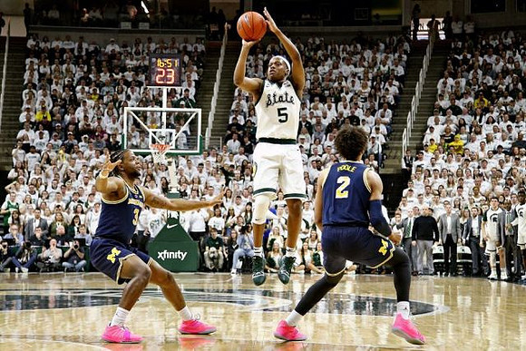 Zavier Simpson (3) and Jordan Poole (2)