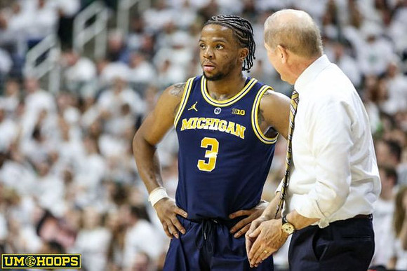 Zavier Simpson (3) and John Beilein
