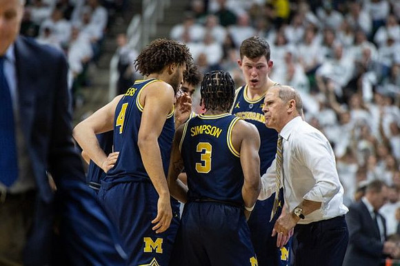 Isaiah Livers (4), Jordan Poole (2), Zavier Simpson (3), Jon Teske (15), and John Beilein