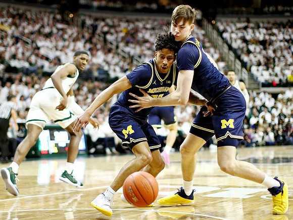 Eli Brooks (55) and Colin Castleton (11)