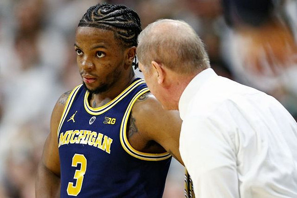 Zavier Simpson (3) and John Beilein
