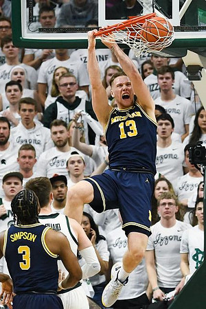 Zavier Simpson (3) and Ignas Brazdeikis (13)