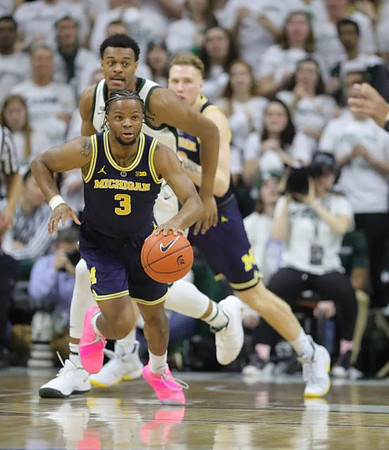 Zavier Simpson (3) and Ignas Brazdeikis (13)
