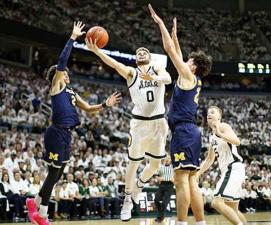 Jordan Poole (2) and Brandon Johns Jr. (23)