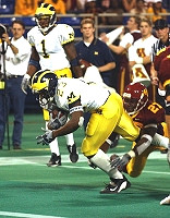 Chris Perry (23) and Braylon Edwards (1)