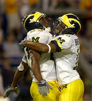 Chris Perry (23) and Steve Breaston (15)