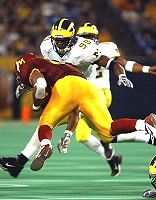 Pierre Woods (99) and Jon Shaw (22)