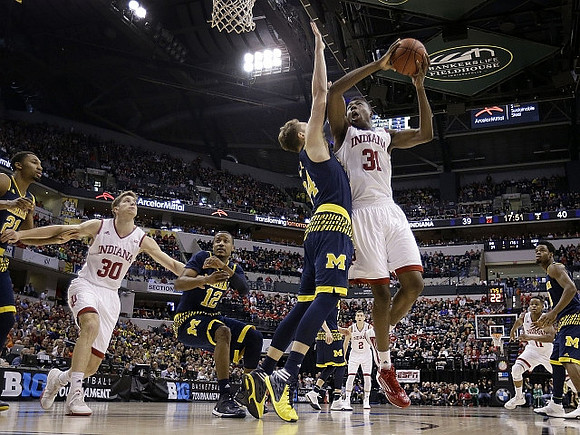 Zak Irvin (21), Muhammad-Ali Abdur-Rahkman (12), Mark Donnal (34), and Derrick Walton Jr. (10)