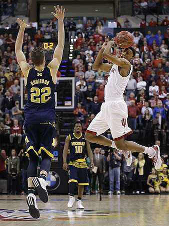 Duncan Robinson (22) and Derrick Walton Jr. (10)