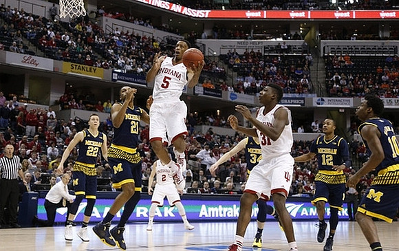 Duncan Robinson (22), Zak Irvin (21), Mark Donnal (34), Muhammad-Ali Abdur-Rahkman (12), and Derrick Walton Jr. (10)