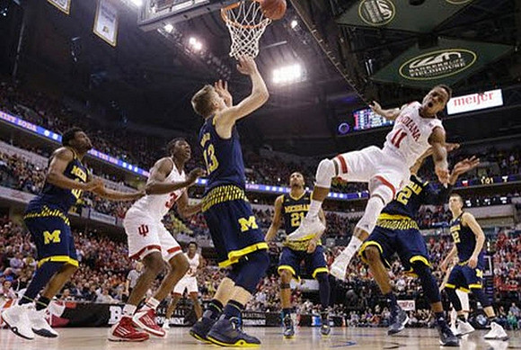 Derrick Walton Jr. (10), Moritz Wagner (13), Zak Irvin (21), Muhammad-Ali Abdur-Rahkman (12), and Duncan Robinson (22)