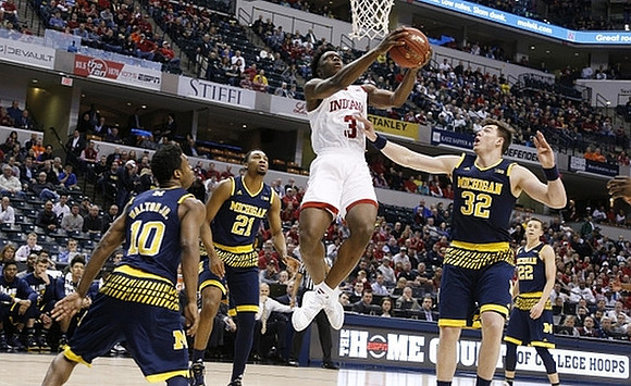 Derrick Walton Jr. (10), Zak Irvin (21), Ricky Doyle (32), and Duncan Robinson (22)