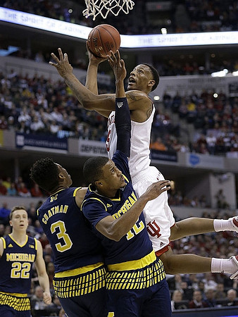 Duncan Robinson (22), Kameron Chatman (3), and Muhammad-Ali Abdur-Rahkman (12)