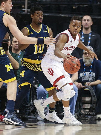 Ricky Doyle (32) and Derrick Walton Jr. (10)