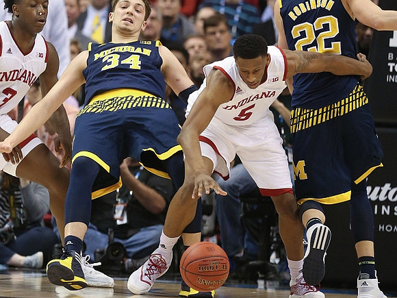 Mark Donnal (34) and Duncan Robinson (22)