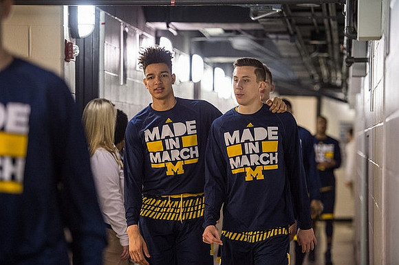 D.J. Wilson (5) and Duncan Robinson (22)