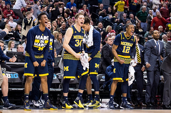 Aubrey Dawkins (24), Mark Donnal (34), D.J. Wilson (5), Muhammad-Ali Abdur-Rahkman (12), and LaVall Jordan