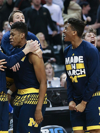 Kameron Chatman (3), Andrew Dakich (11), Aubrey Dawkins (24), and Ricky Doyle (32)