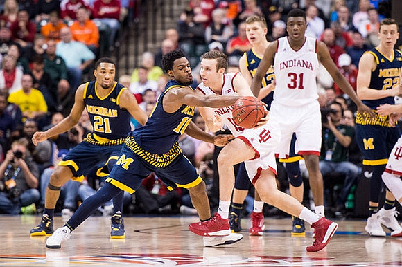 Zak Irvin (21), Derrick Walton Jr. (10), Moritz Wagner (13), and Duncan Robinson (22)