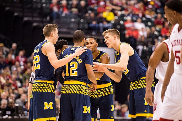 Duncan Robinson (22), Muhammad-Ali Abdur-Rahkman (12), Derrick Walton Jr. (10), Zak Irvin (21), and Moritz Wagner (13)