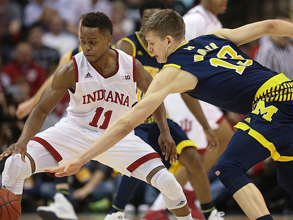 Derrick Walton Jr. (10) and Moritz Wagner (13)