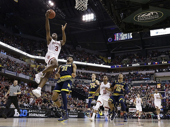 Zak Irvin (21), Mark Donnal (34), and Muhammad-Ali Abdur-Rahkman (12)