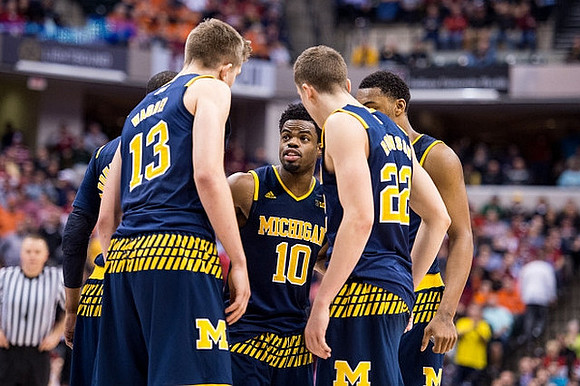 Muhammad-Ali Abdur-Rahkman (12), Moritz Wagner (13), Derrick Walton Jr. (10), Duncan Robinson (22), and Zak Irvin (21)