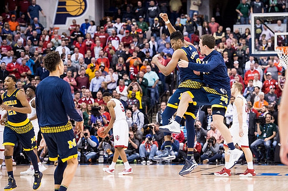 Zak Irvin (21), D.J. Wilson (5), Kameron Chatman (3), and Andrew Dakich (11)