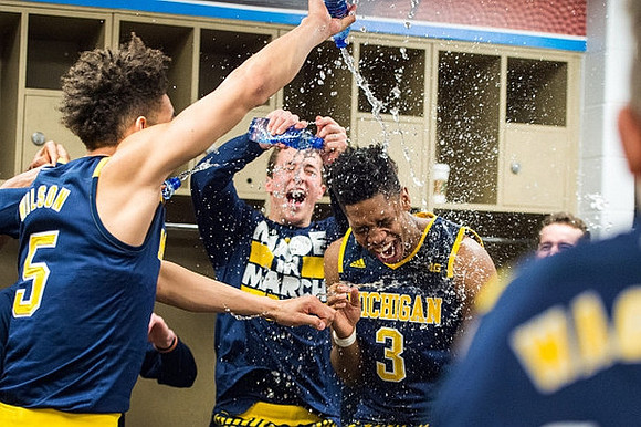 D.J. Wilson (5), Andrew Dakich (11), and Kameron Chatman (3)
