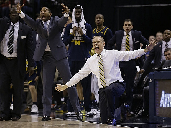 Bacari Alexander, LaVall Jordan, Caris LeVert (23), Muhammad-Ali Abdur-Rahkman (12), and John Beilein
