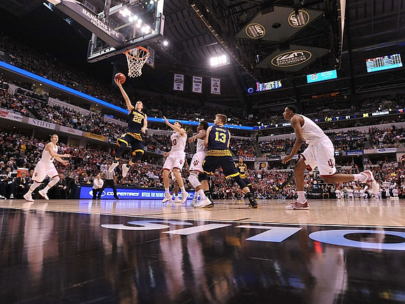 Duncan Robinson (22), Moritz Wagner (13), and Zak Irvin (21)