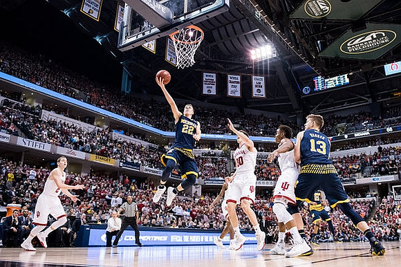 Duncan Robinson (22) and Moritz Wagner (13)