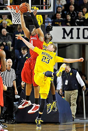 Tim Hardaway Jr. (10) and Evan Smotrycz (23)