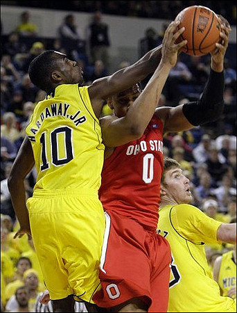 Tim Hardaway Jr. (10) and Evan Smotrycz (23)
