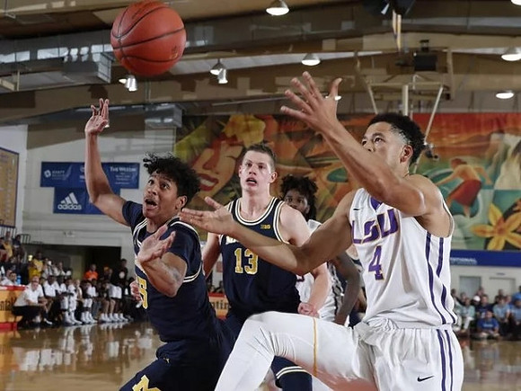 Eli Brooks (55) and Moritz Wagner (13)
