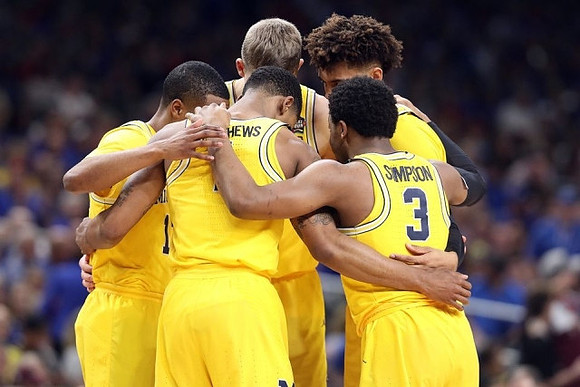 Muhammad-Ali Abdur-Rahkman (12), Charles Matthews (1), Moritz Wagner (13), Isaiah Livers (4), and Zavier Simpson (3)