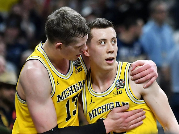 Moritz Wagner (13) and Duncan Robinson (22)