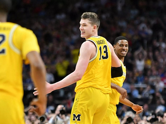 Muhammad-Ali Abdur-Rahkman (12), Moritz Wagner (13), and Charles Matthews (1)