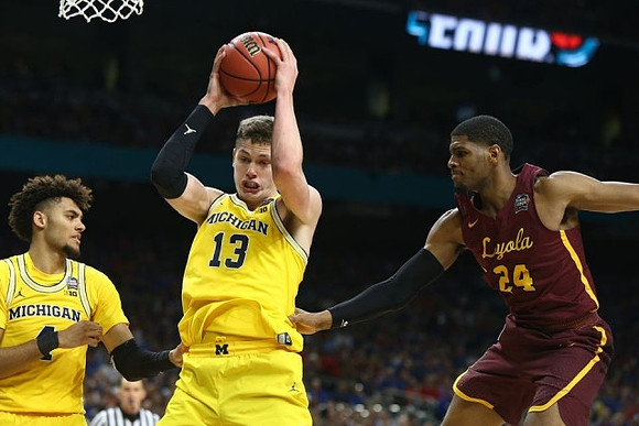 Isaiah Livers (4) and Moritz Wagner (13)