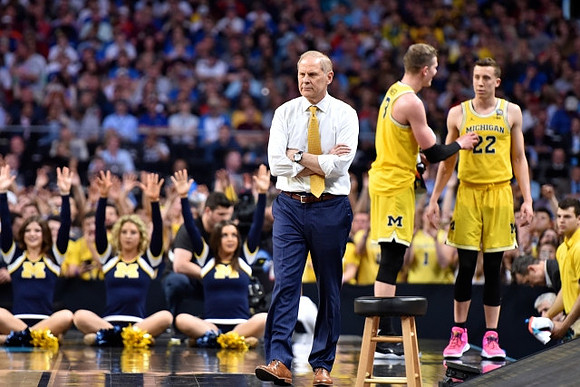 John Beilein, Moritz Wagner (13), and Duncan Robinson (22)
