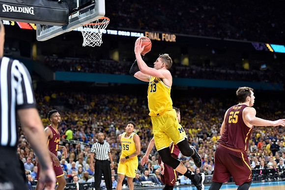 Eli Brooks (55) and Moritz Wagner (13)