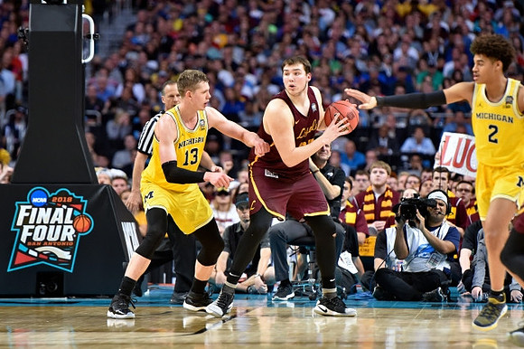 Moritz Wagner (13) and Jordan Poole (2)