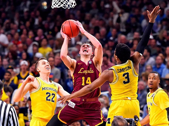 Duncan Robinson (22), Zavier Simpson (3), and Muhammad-Ali Abdur-Rahkman (12)