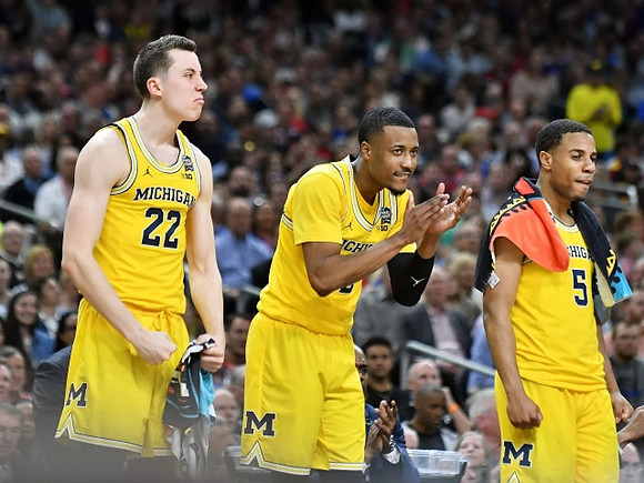 Duncan Robinson (22), Muhammad-Ali Abdur-Rahkman (12), and Jaaron Simmons (5)