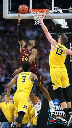Zavier Simpson (3) and Moritz Wagner (13)