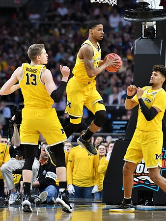 Moritz Wagner (13), Charles Matthews (1), and Isaiah Livers (4)