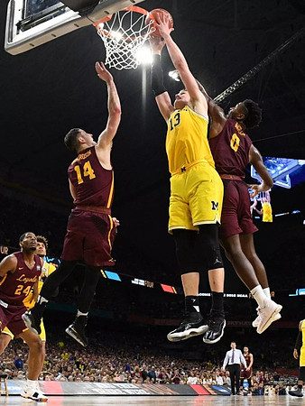 Moritz Wagner (13) and Isaiah Livers (4)