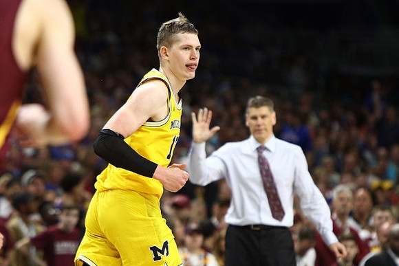 Moritz Wagner (13) and Loyola Chicago Head Coach Porter Moser