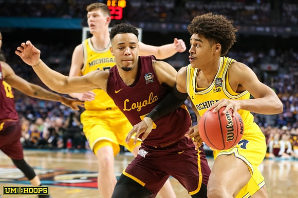 Jon Teske (15) and Jordan Poole (2)