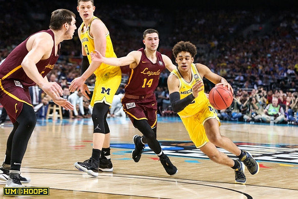 Moritz Wagner (13) and Jordan Poole (2)